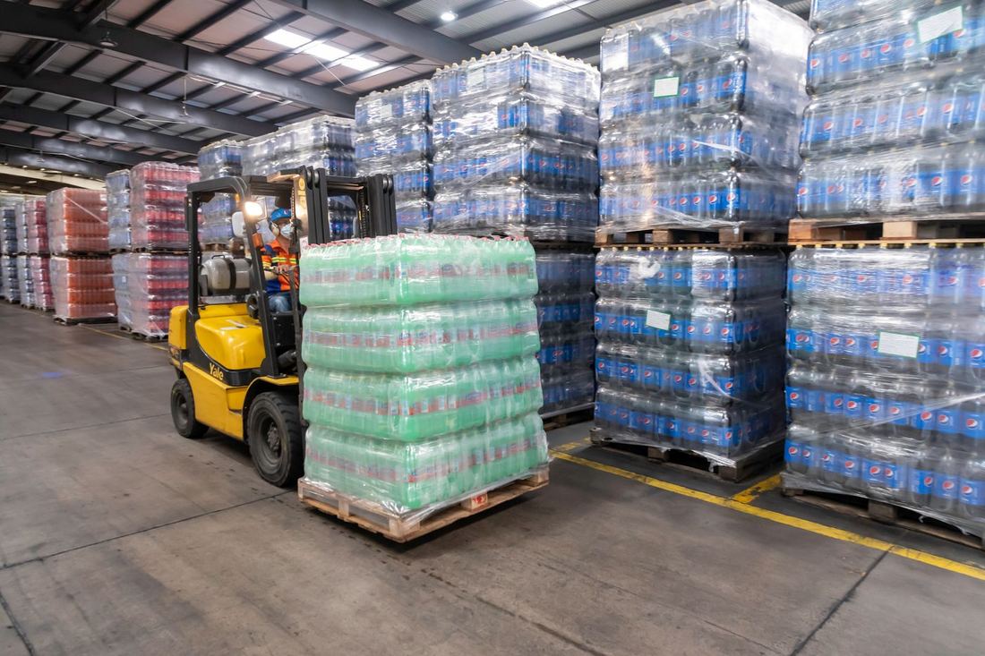 Forklift moving pallets in a U.S. distribution warehouse